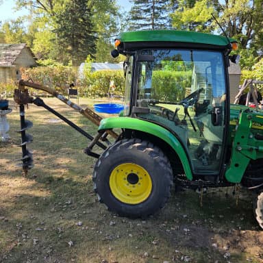 Side picture of a green tractor